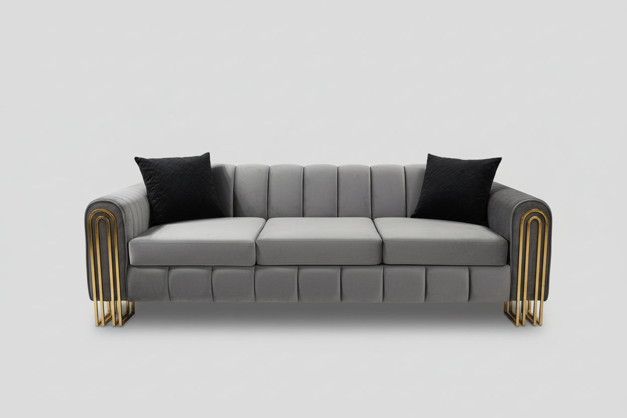 Gray sofa with decorative pillows in a showroom setting